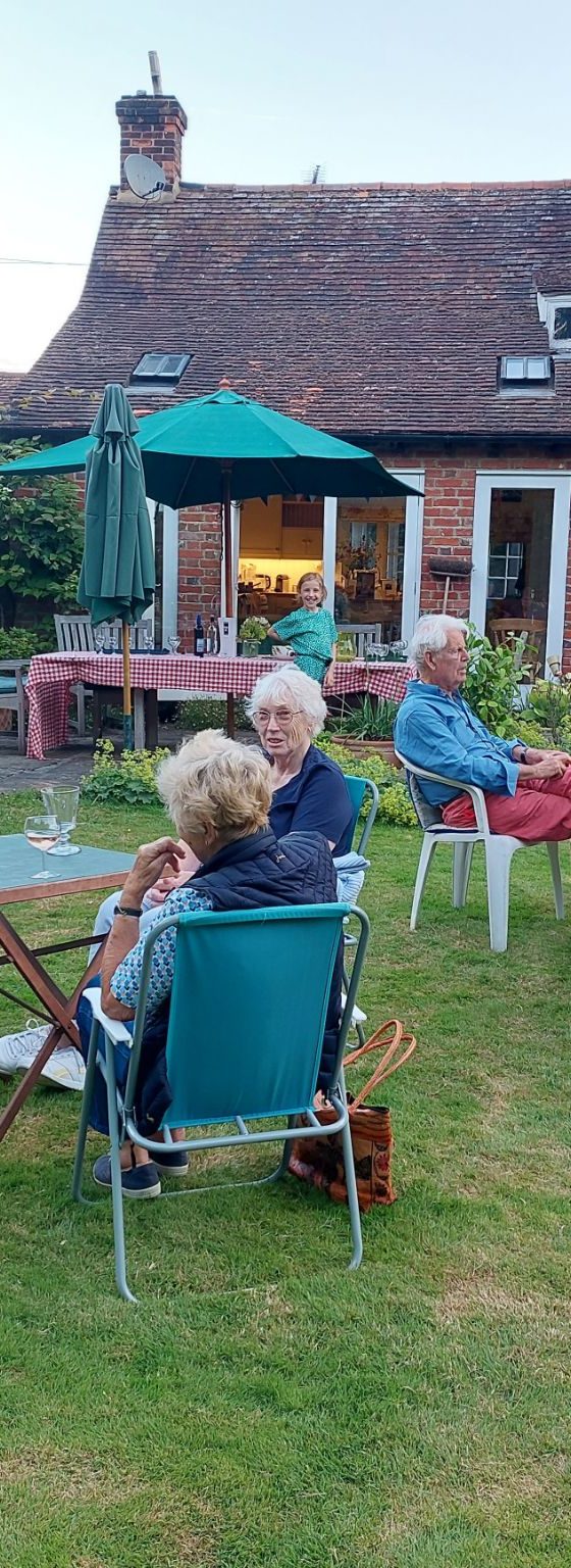 members of the mountfitchet garden club sitting int eh gardens at Thundridge Hill House